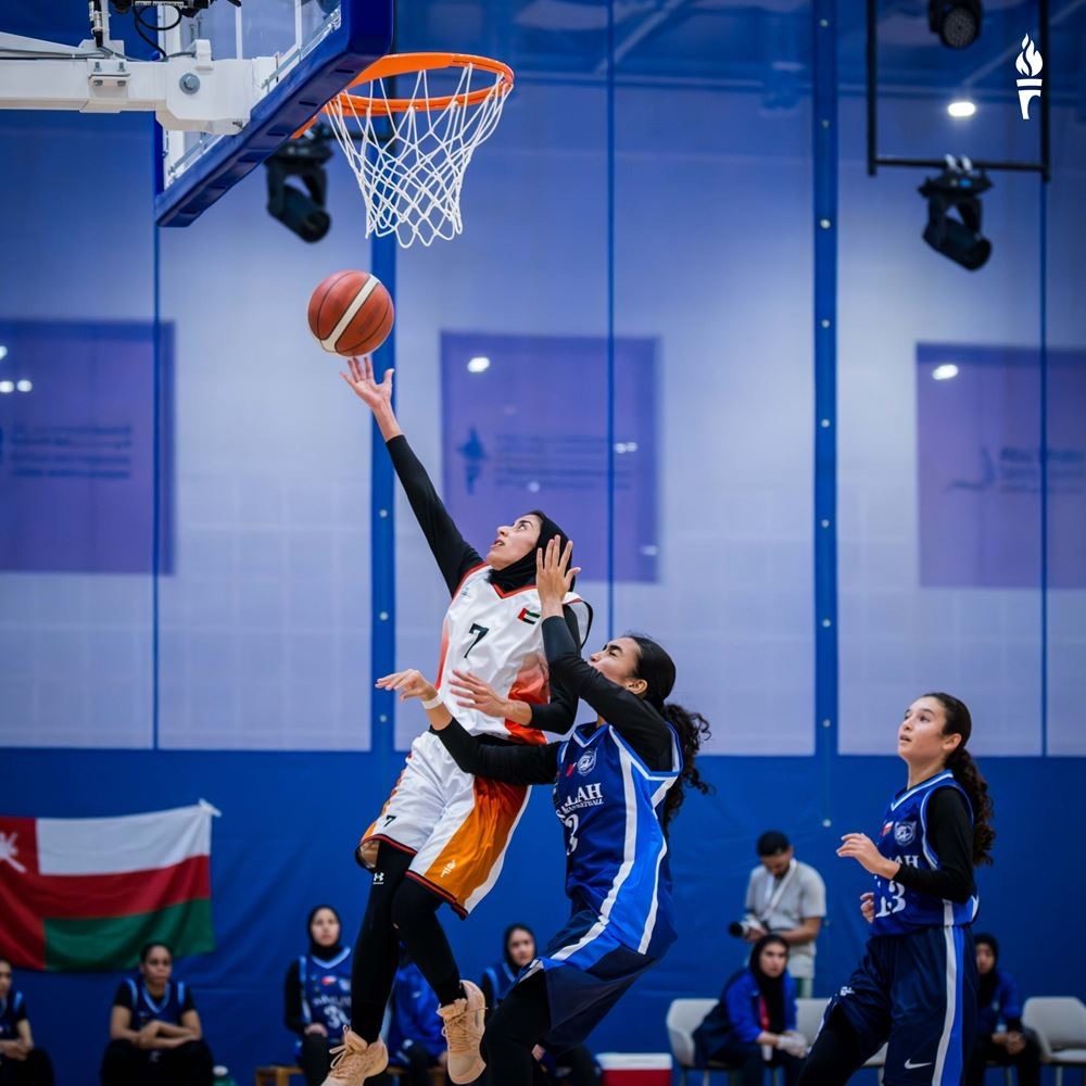A layup under the rim in a Women Open Cup game